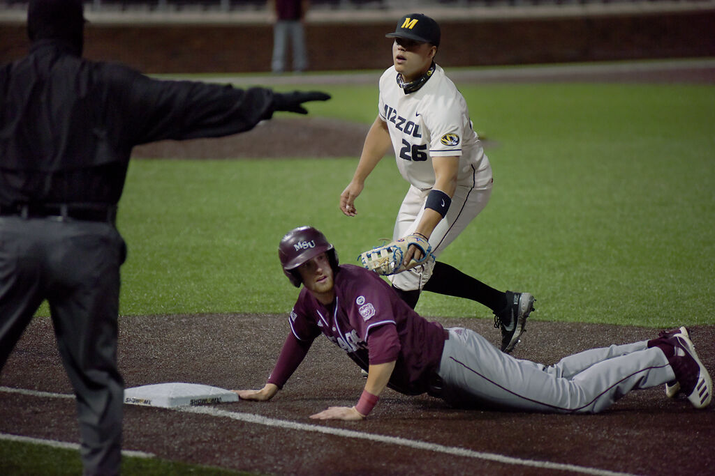 Torin Montgomery, right, attempts to tag